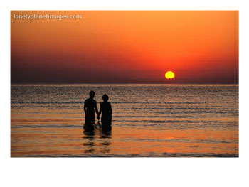 Couple Holding Hands at Sunset Over the Bay of Alcudia, Mallorca, Balearic Islands, Spain